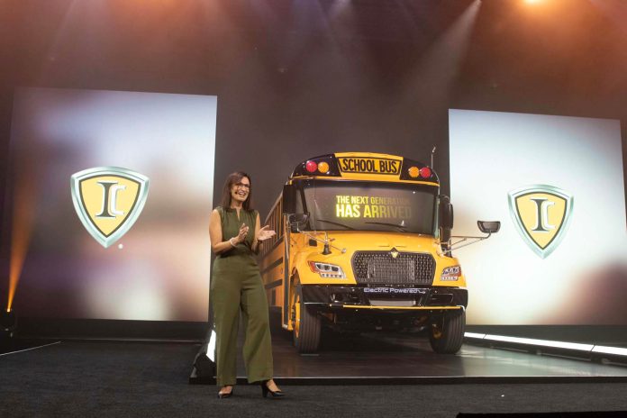 IC Bus VP and GM Justina Morosin unveils the redesigned CE Series school bus, the first model overhaul in 20 years, during an event on Friday, July 14, 2023.