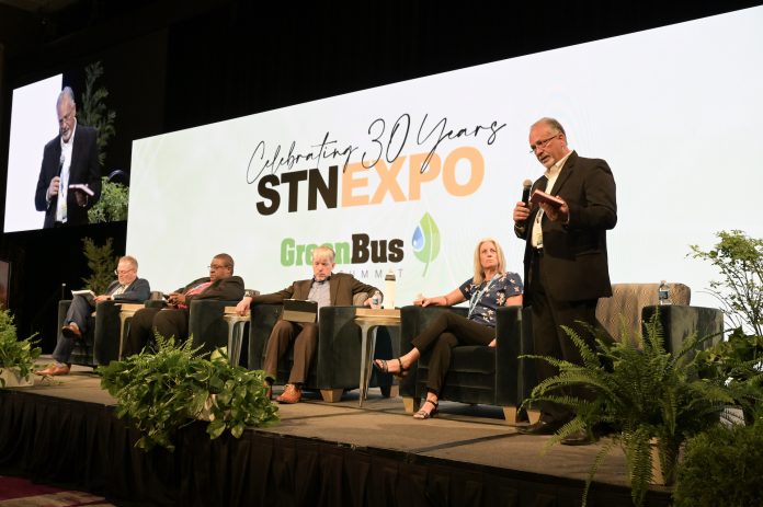 Alex Cook of First Student, far right, addresses the audience during a panel discussion on electric school bus user experiences during the Green Bus Summit at STN EXPO Reno on July 16, 2023. Photo by Philicia Endelman.