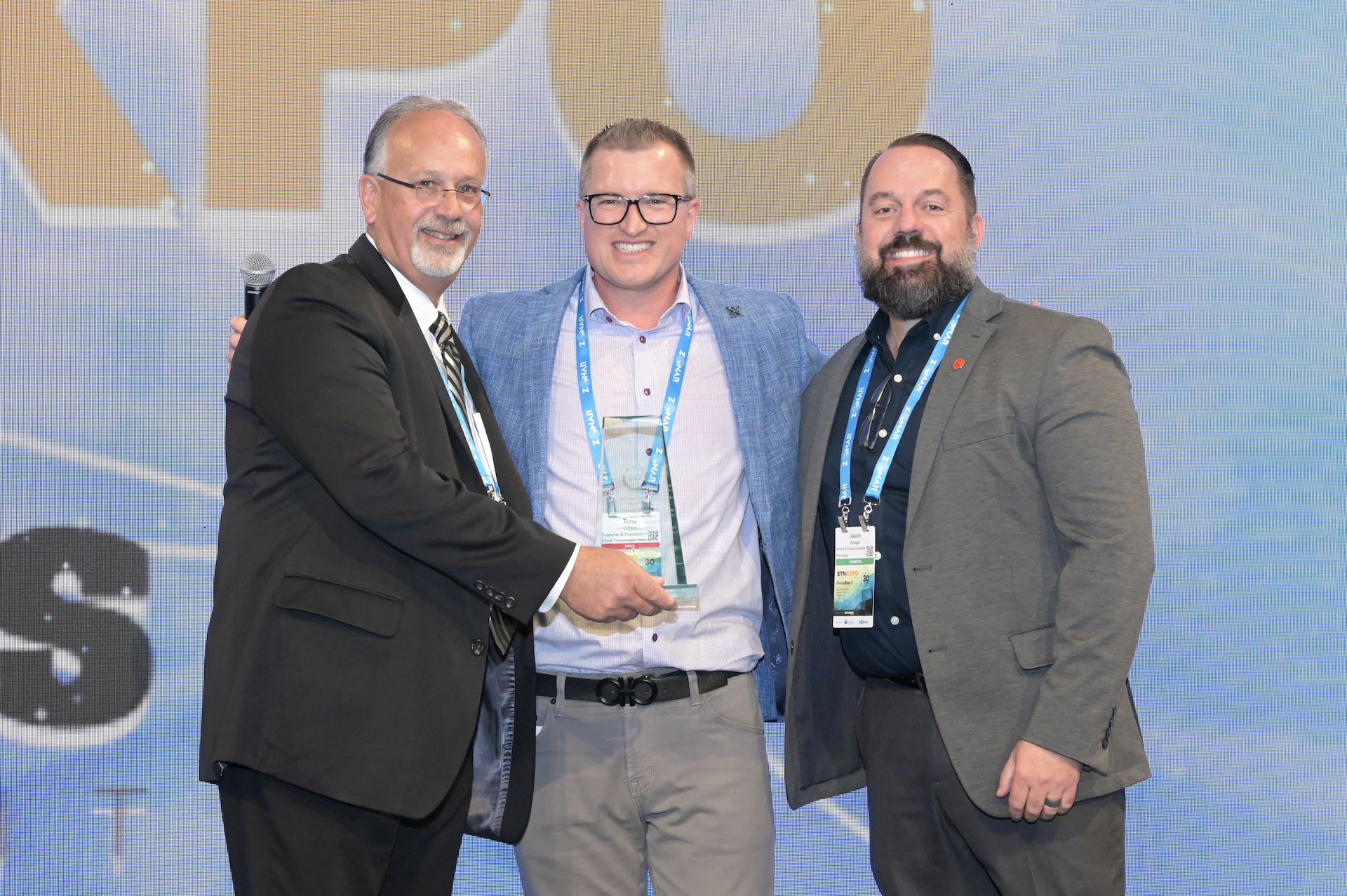 Alex Cook, chief engineer, and Jason Songer, senior EV principal consultant, accept the Private Fleet Category award for First Student (Photo by Philicia Endelman.)