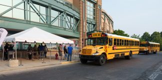 Electric school buses line up for the Green Bus Summit ride-and-drive event during STN EXPO Indianapolis on June 5, 2023. (Photo by Vincent Rios Design.)
