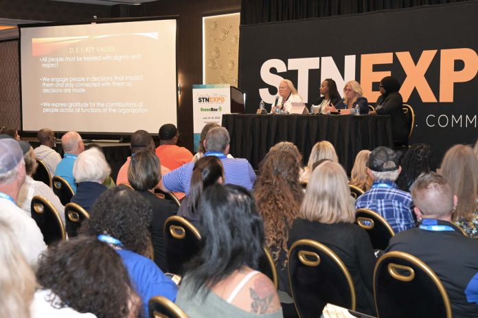 Consultant Alexandra Robinson (seated to right of podium) commenced the DEI panel discussion at STN EXPO Reno on July 17, 2023. Robinson was joined by (to her left) Rosalyn Vann-Jackson, the chief support services officer for Broken Arrow Public Schools in Oklahoma; Sandy Dillman, the director of transportation at Tomball Independent School District in Texas; and Teresa Fleming, the interim deputy chief operating officer for transportation at the School District of Philadelphia in Pennsylvania. (Photo by Philicia Endelman.)