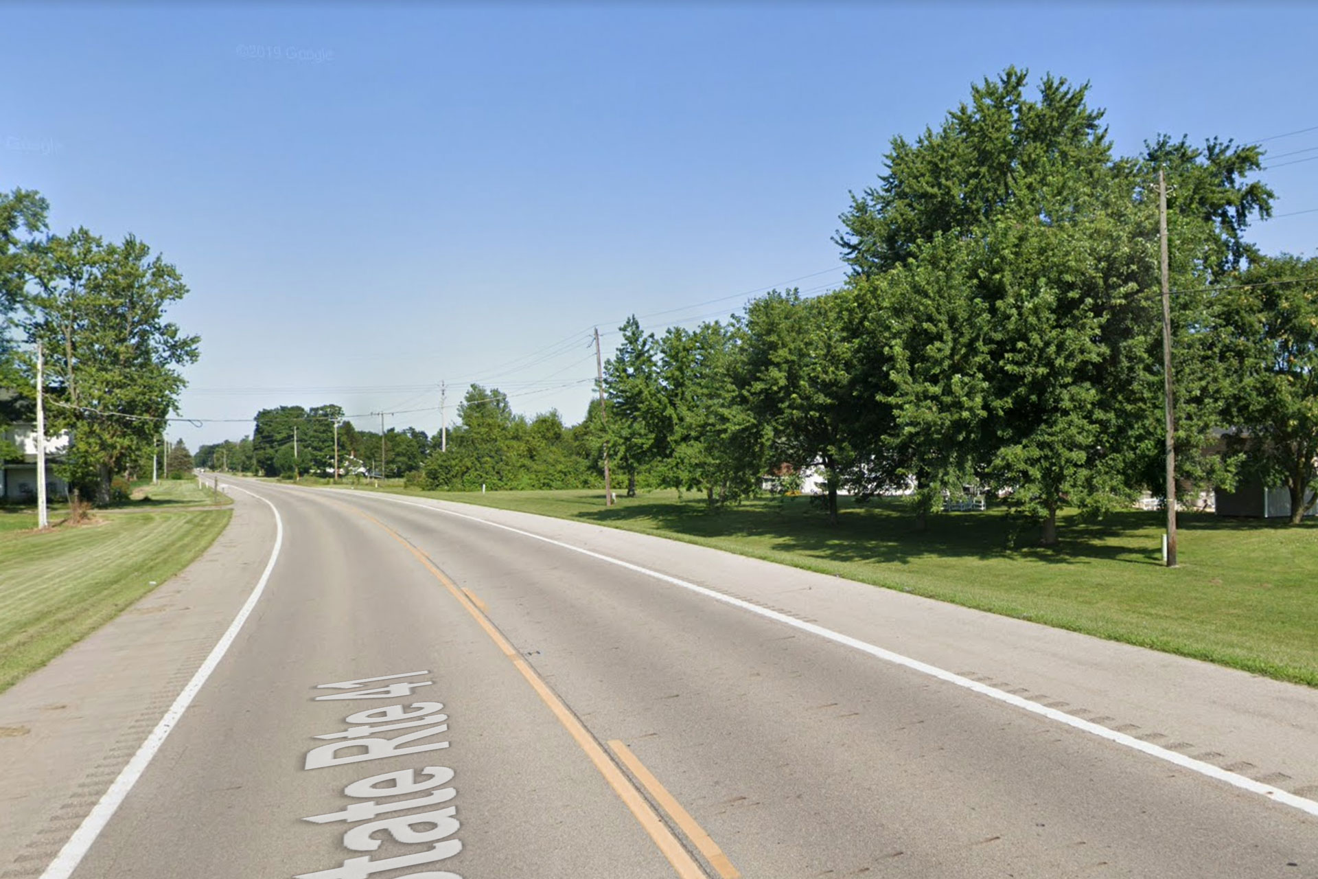 The location on Ohio State Road 41 near Lawrenceville Road, based on police statements and media photos, where a minivan collided with a school bus nearly head-on, resulting in a student fatality and 23 injuries on Tuesday, Aug. 22, 2023.