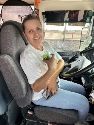 A Clint Independent School District bus driver for East Montana Middle School in Texas, receives a gift for National School Bus Safety Week.