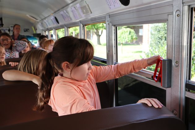 An Upper Moreland School District student in Pennsylvania practices emergency evacuation of a school bus.