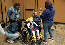 Attendees at the 2023 TSD Conference receive hands-on wheelchair securement training (Photo by Vincent Rios Creative)