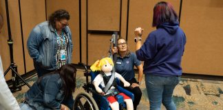 Attendees at the 2023 TSD Conference receive hands-on wheelchair securement training (Photo by Vincent Rios Creative)
