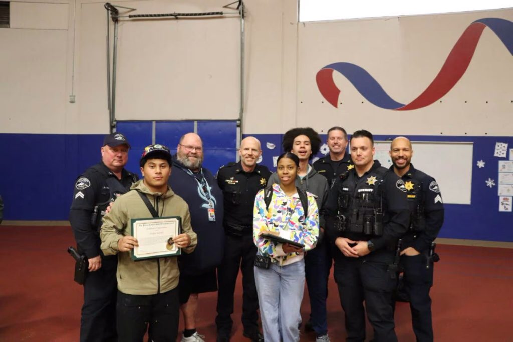 Students receive an award for their heroic actions in brining their school bus to a stop after their driver fell unconscious in December. Photo courtesy of the Pierce County Sheriff's Office.