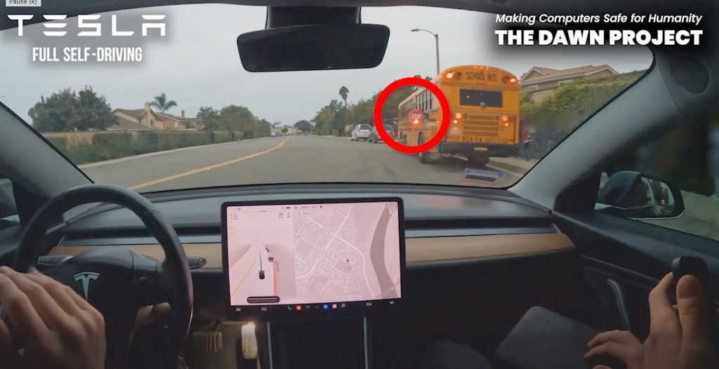 Still image from a video showing a test by the Dawn Project of a Telsa in Full Self-Driving mode but passing a stopped school bus. 