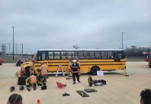 Firefighters prepare to cut into a school bus during a full day of emergency exercises and training, held March 2, 2024 at Cypress-Fairbanks ISD in Houston, Texas. (Photo courtesy of Facebook/Operation-STEER-ESC-6)