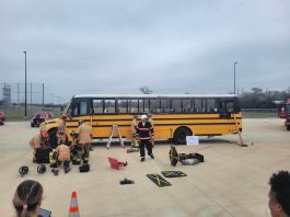 Firefighters prepare to cut into a school bus during a full day of emergency exercises and training, held March 2, 2024 at Cypress-Fairbanks ISD in Houston, Texas. (Photo courtesy of Facebook/Operation-STEER-ESC-6)