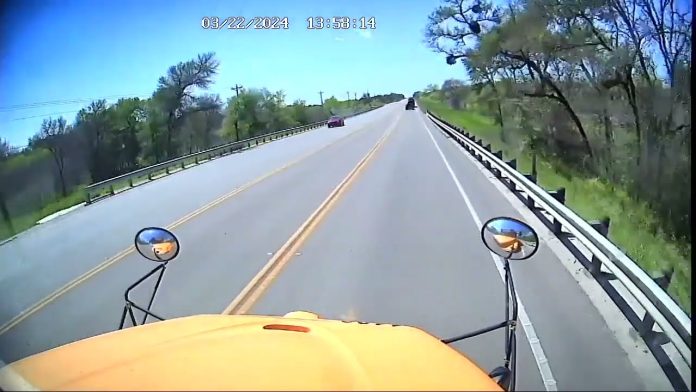 Screenshot of dash cam footage from the Hays CISD school bus that minutes later would be struck by a concrete pump truck, resulting in a fatal roll over crash on March 22, 2024.